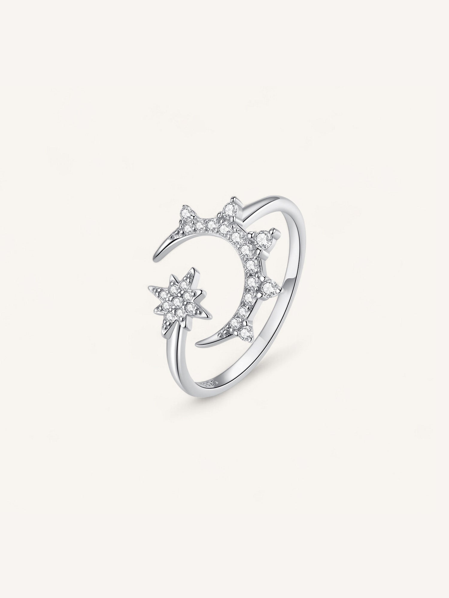 Anillo abierto de lata de ley de luna y estrella con circonitas.