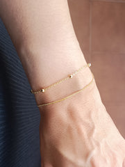 Pulsera doble bolitas oro